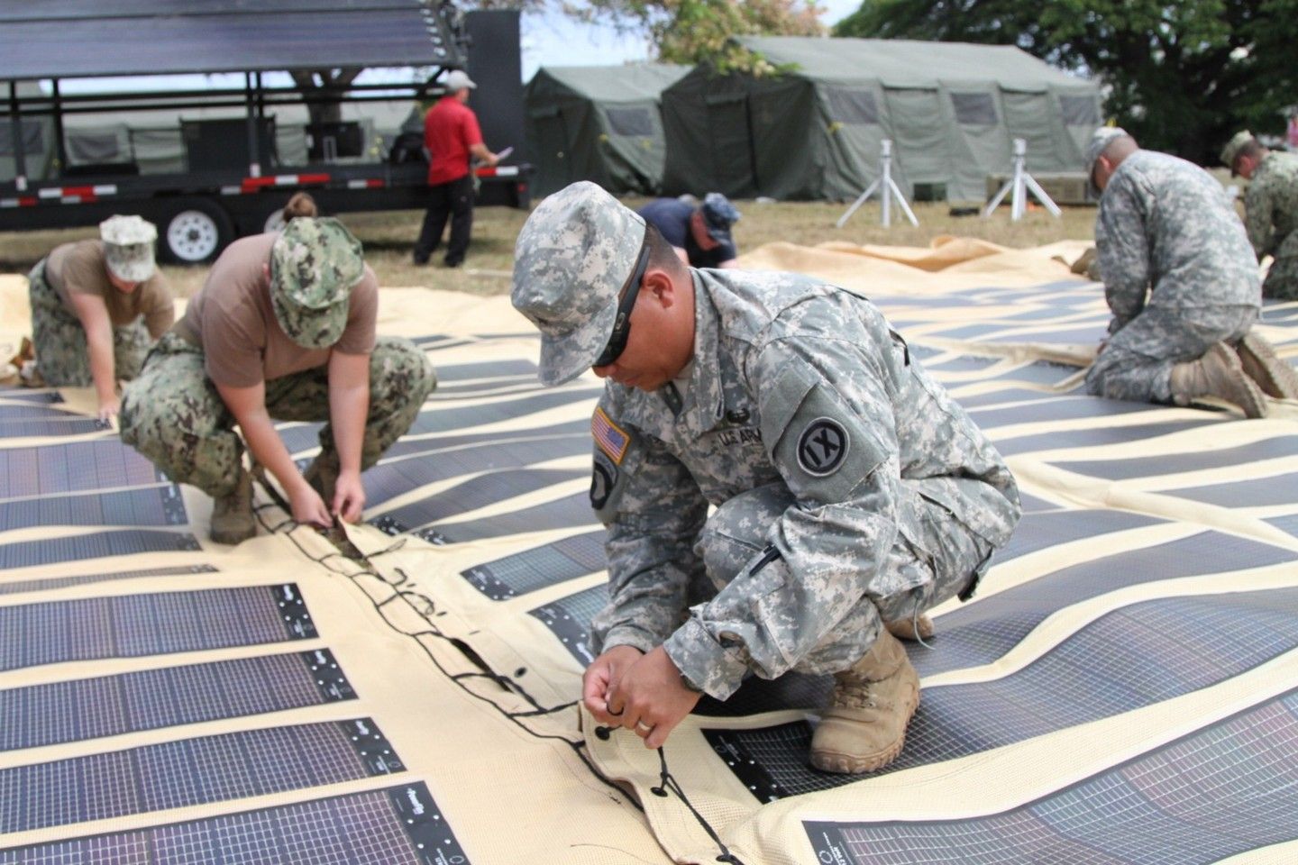 soldiers in uniform constructing renewable power systems 